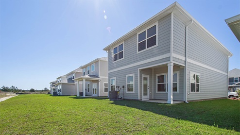 Monroe floor plan at WindMark Beach rear of home with covered rear patio.