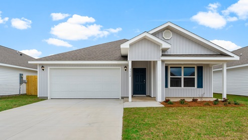 Cali floor plan with vinyl siding and covered front porch and two car garage.