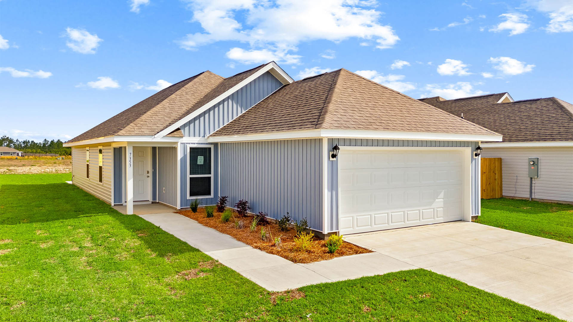 Celeste floor plan at Morningside front of home with vinyl siding and two car garage.