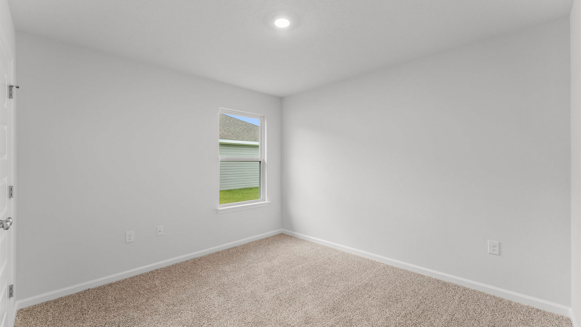 Bedroom with closet and carpet floor and window.