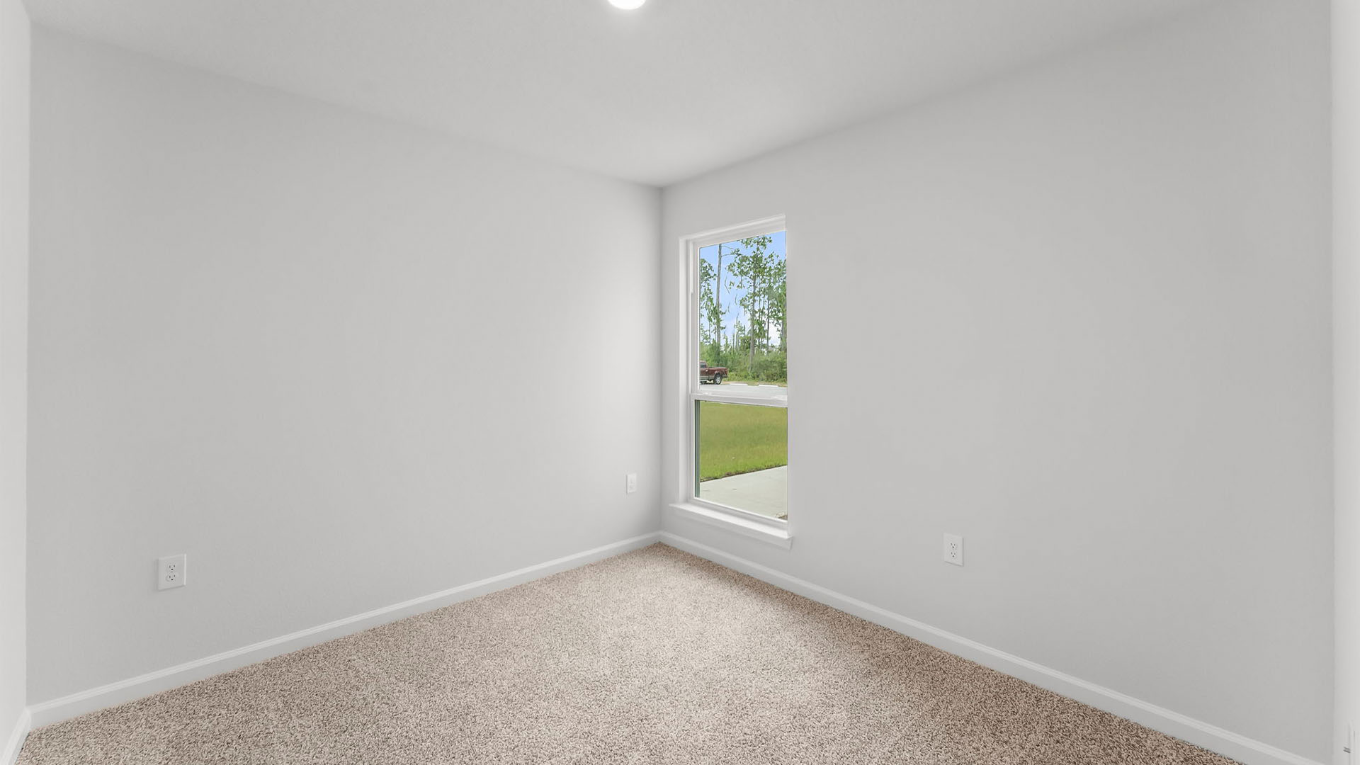 Bedroom with closet and carpet floor and window.