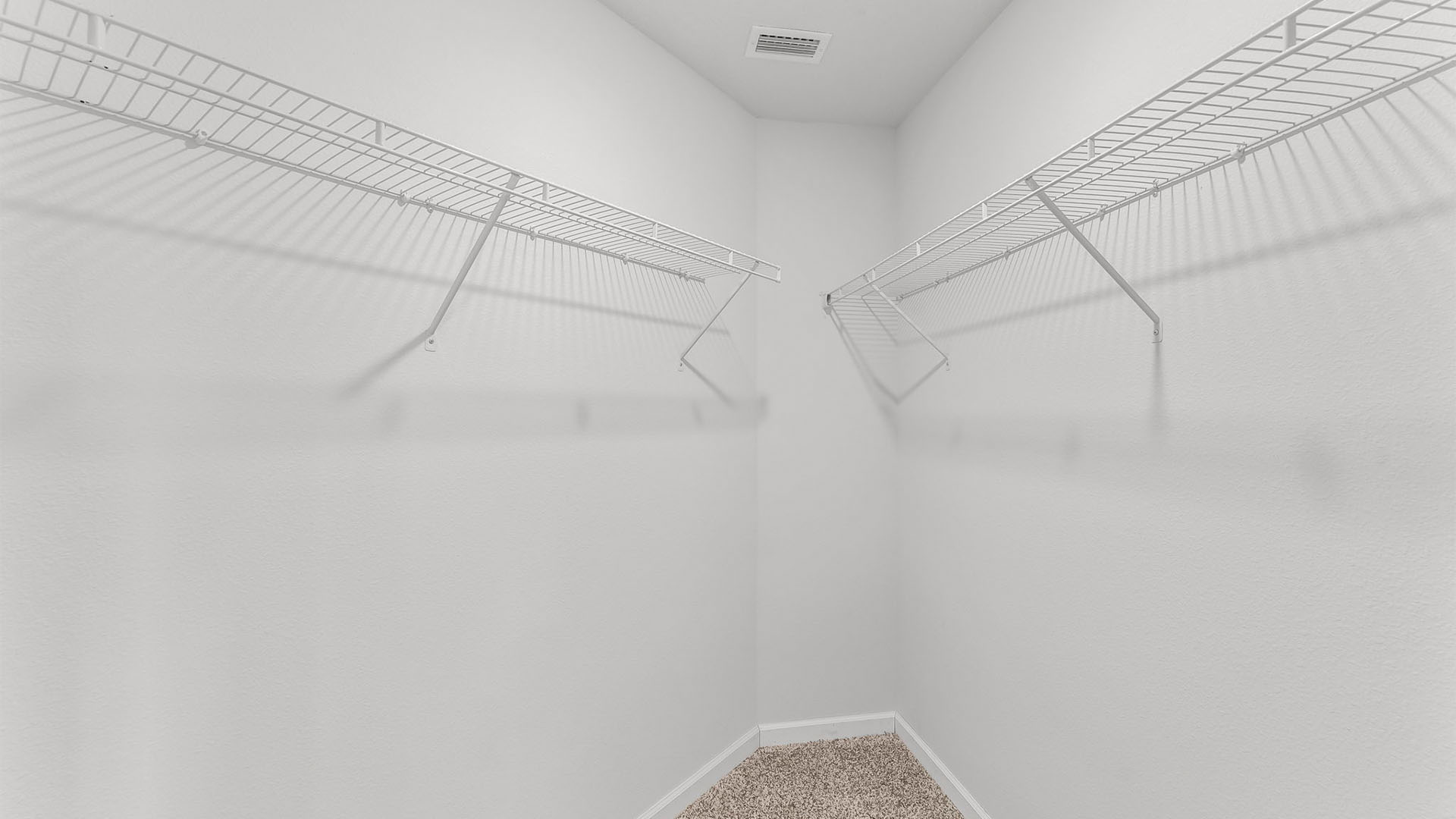 Bedroom with closet and carpet floors.