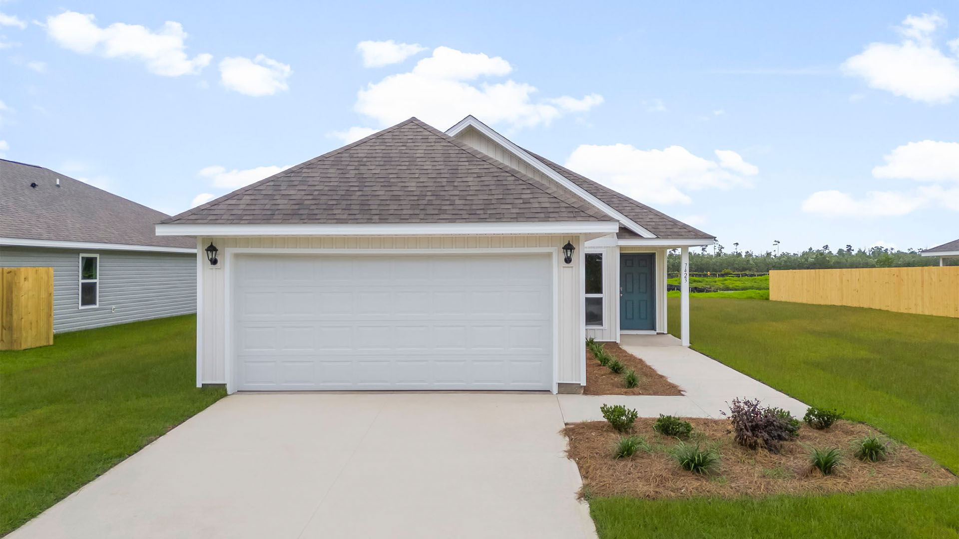 Celeste floor plan at Morningside front of home with vinyl siding and two car garage.