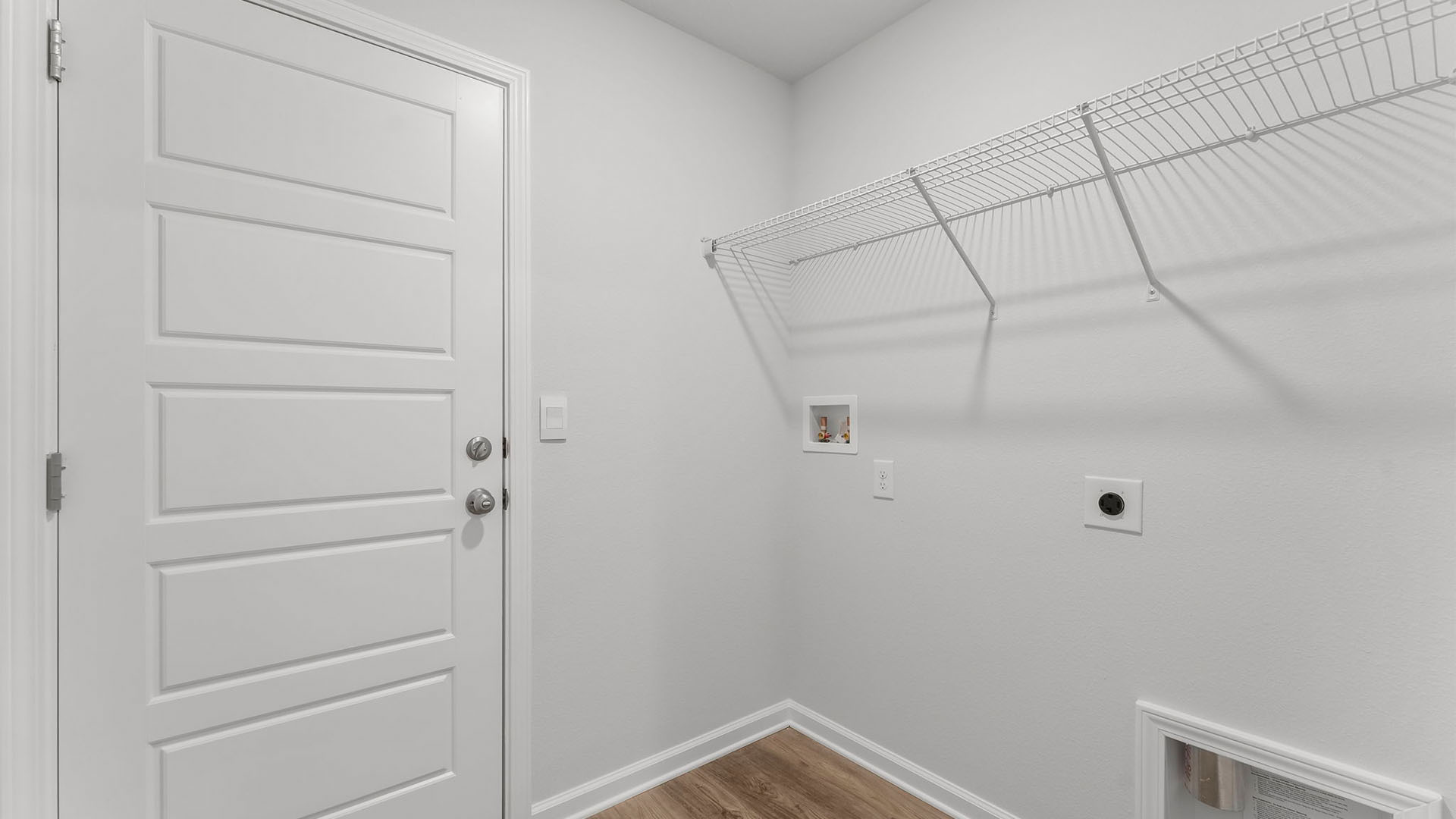 Laundry room with ventilated shelving.