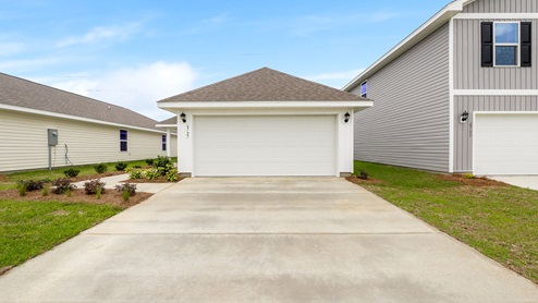 Celeste floor plan at Morningside front of home with vinyl siding and two car garage.