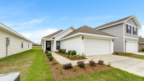 Celeste floor plan at Morningside front of home with vinyl siding and two car garage.