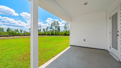 Covered rear patio of Cali floor plan at Morningside.