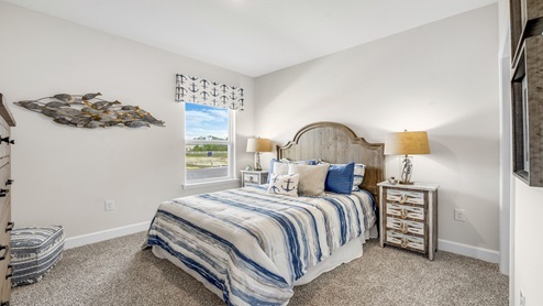 Hodges Bayou Plantation model home bedroom with carpet floors.