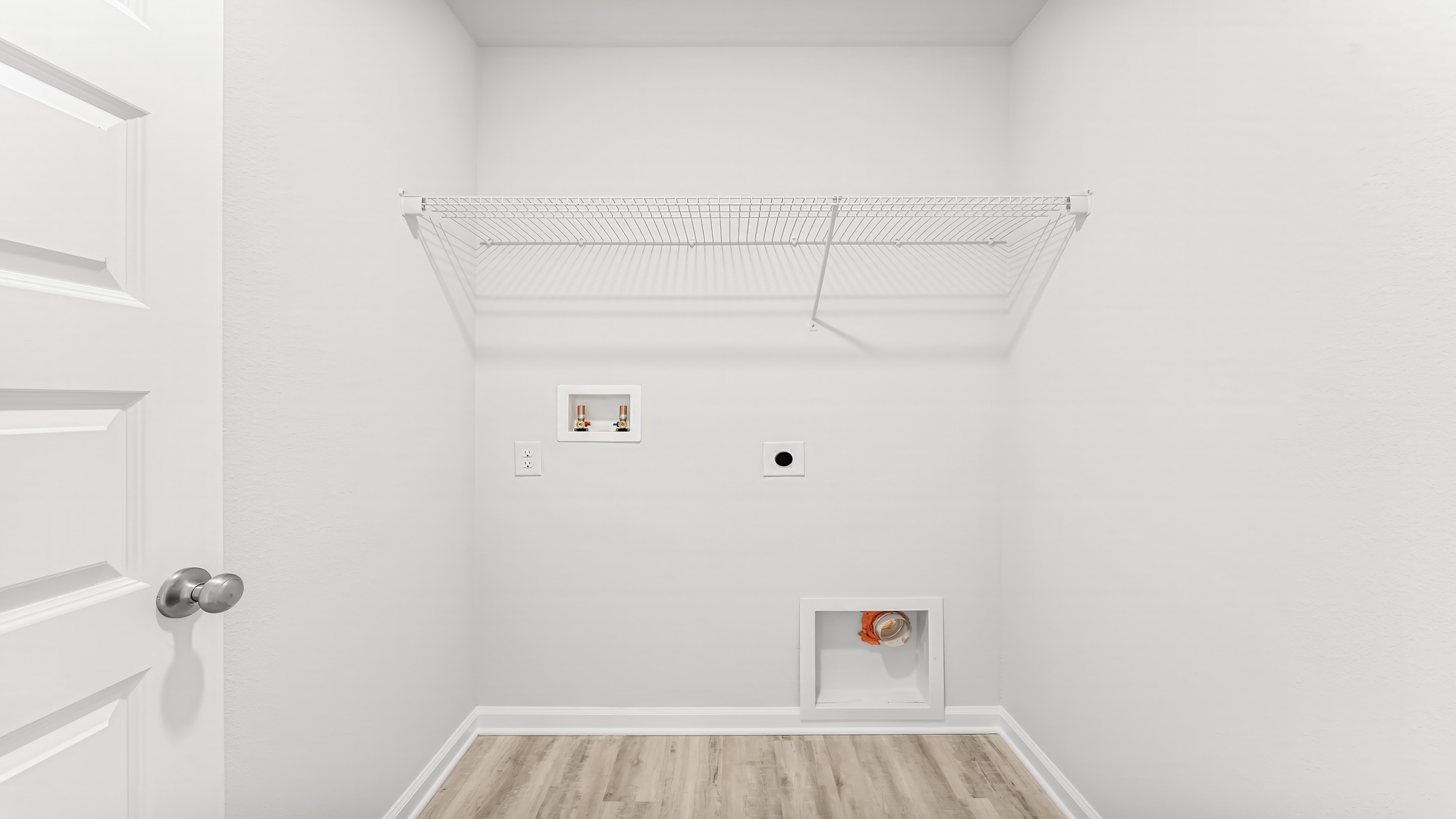 Upstairs laundry room with ventilated shelving.