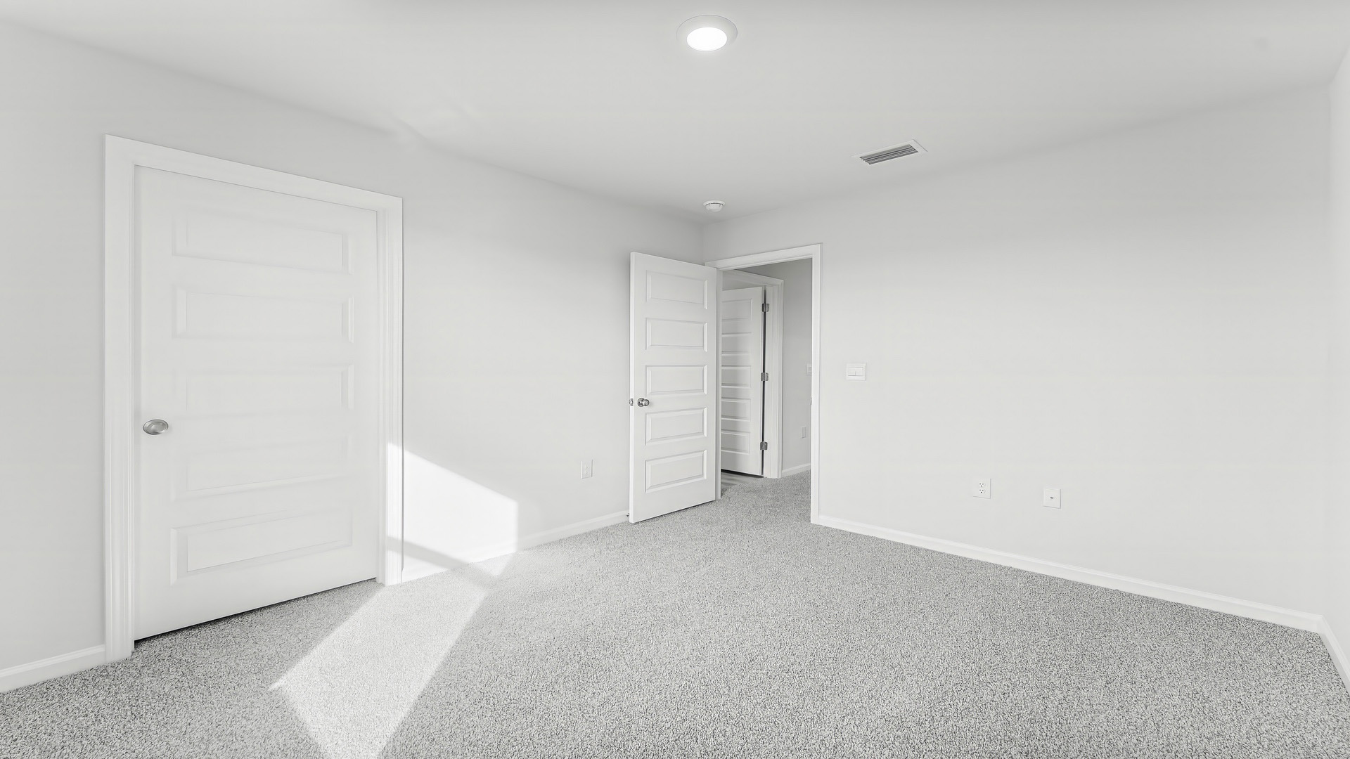 Bedroom with carpet floor and closet.