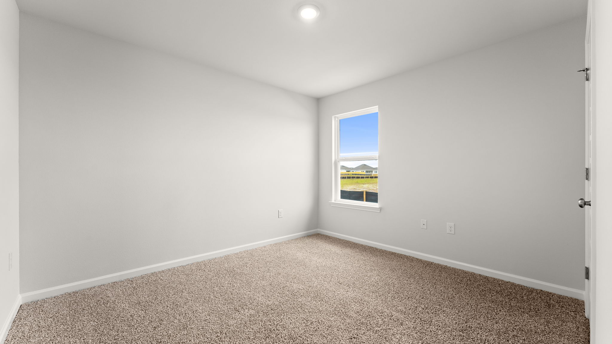 Bedroom with carpet floor and window and closet.