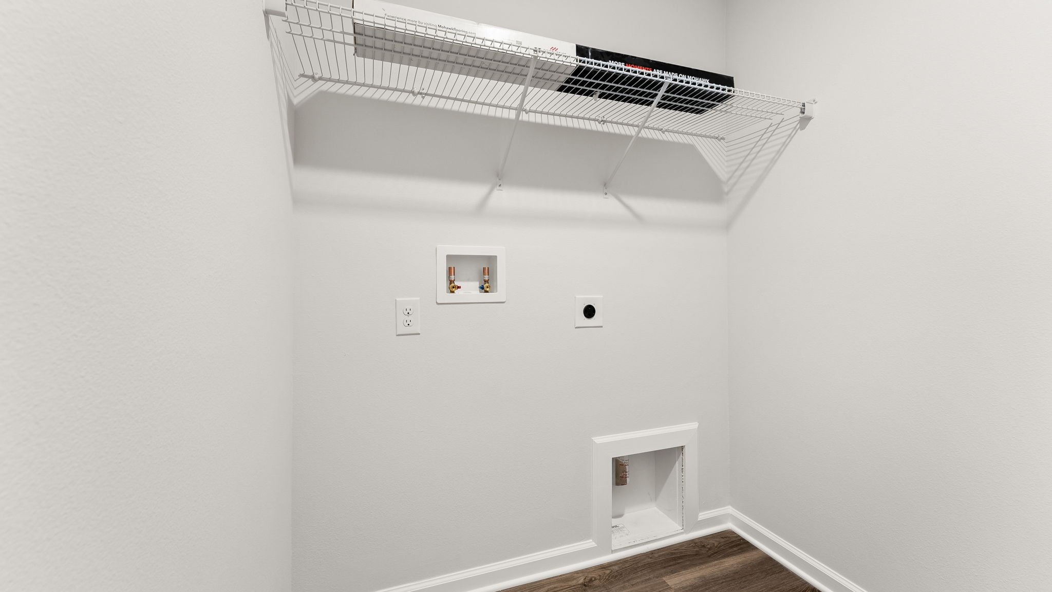 Laundry room with ventilated shelving.