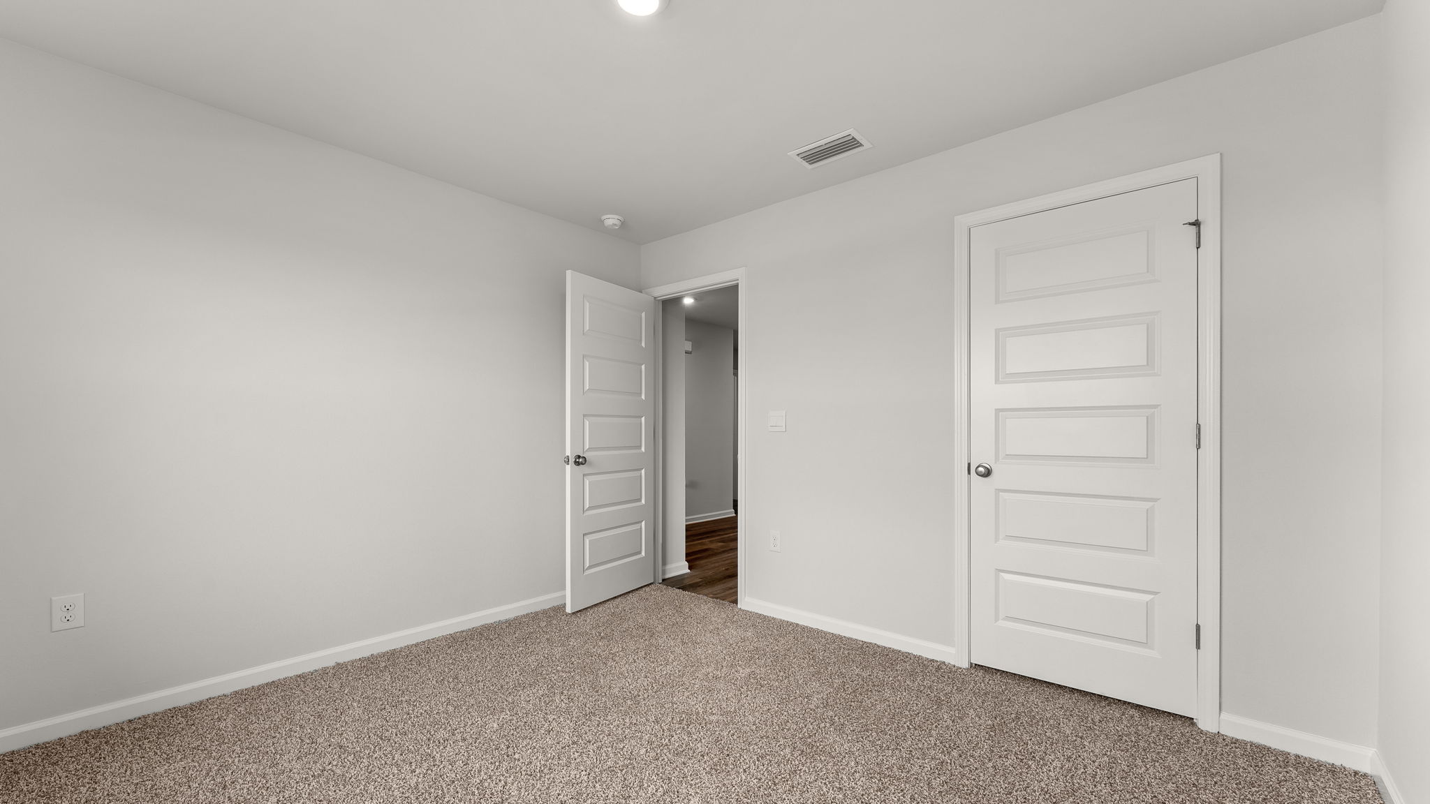 Bedroom with carpet floor and closet.