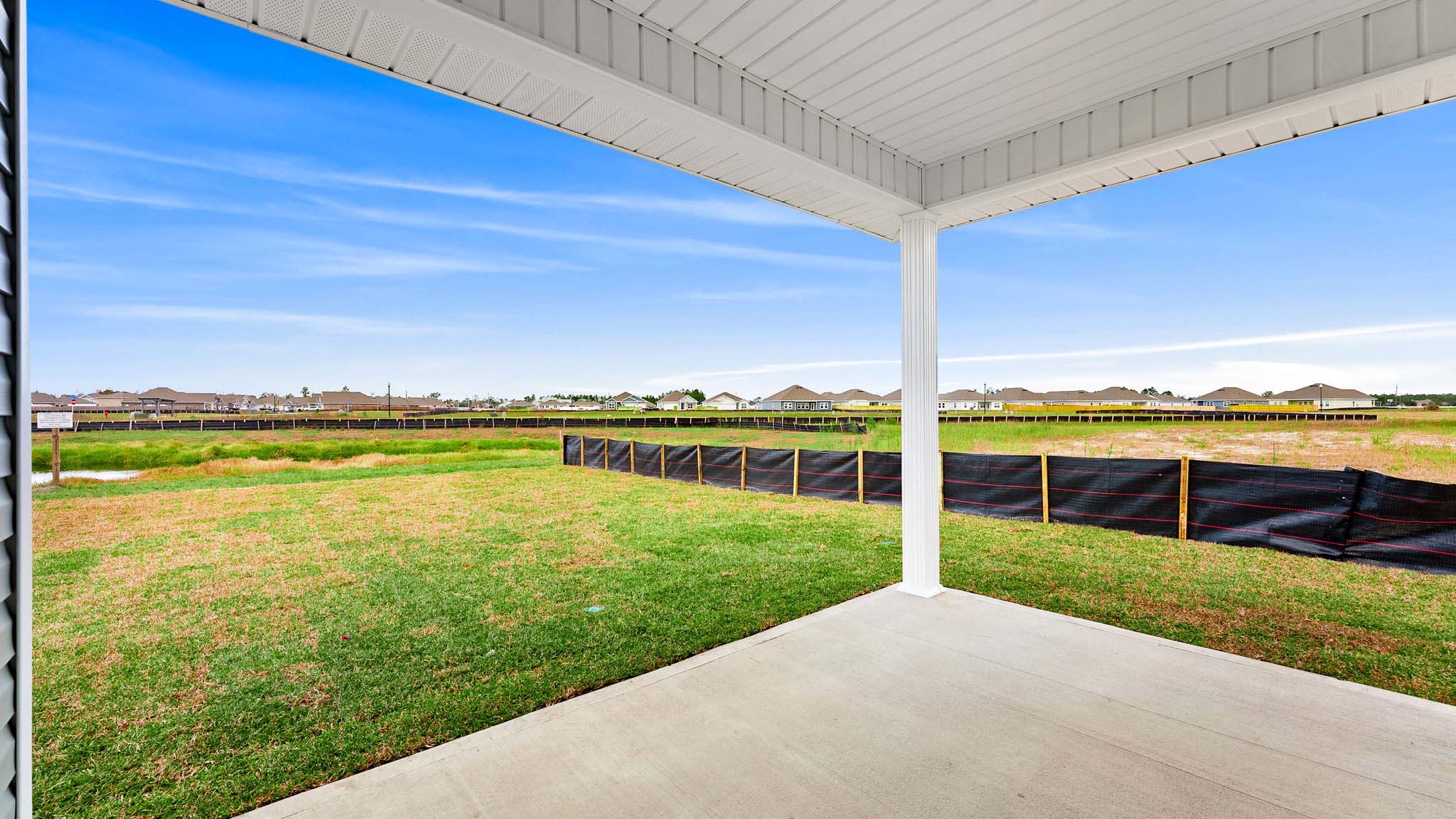 Covered back patio view of back yard.