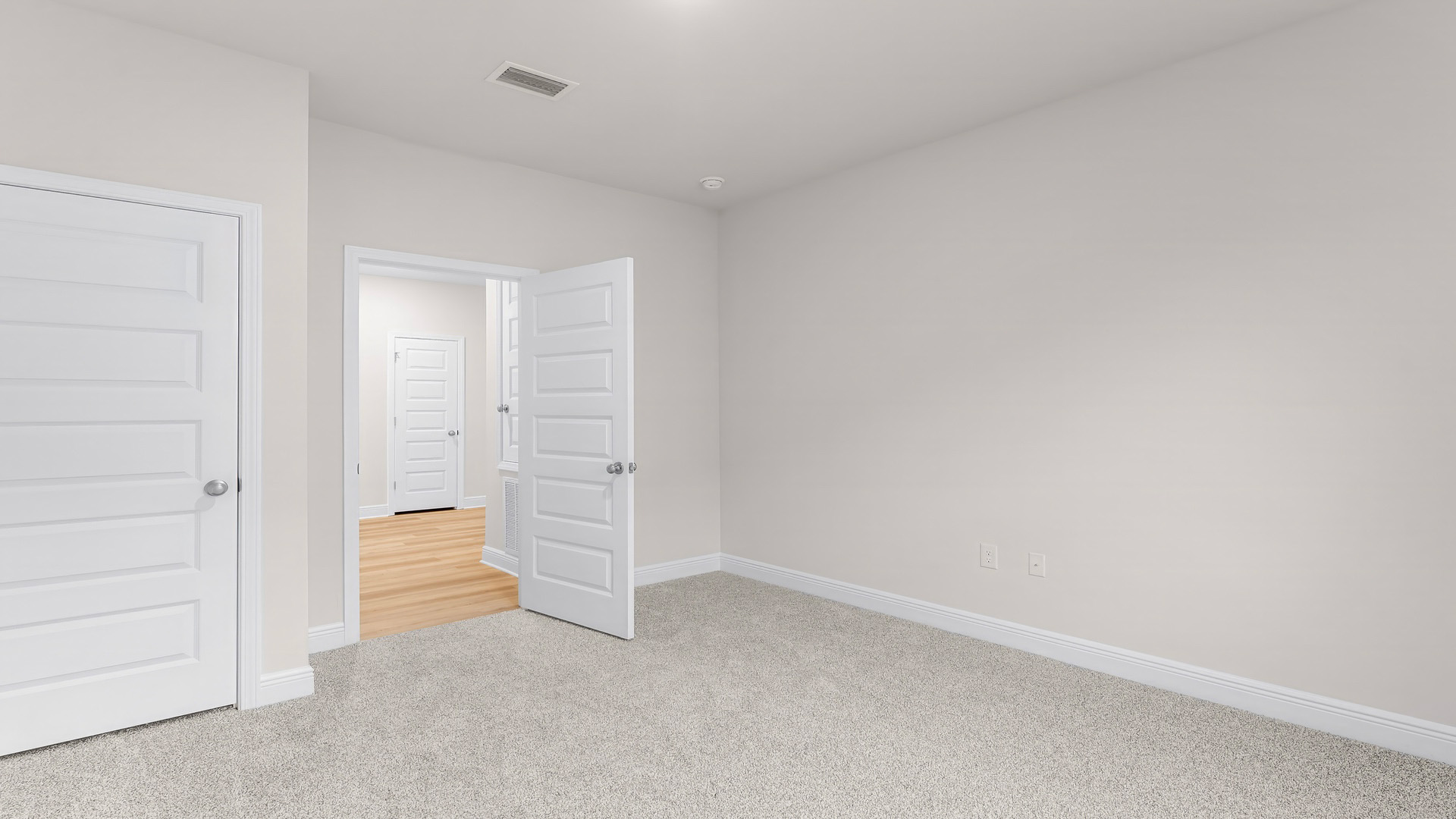 Bedroom with carpet floors and closet.