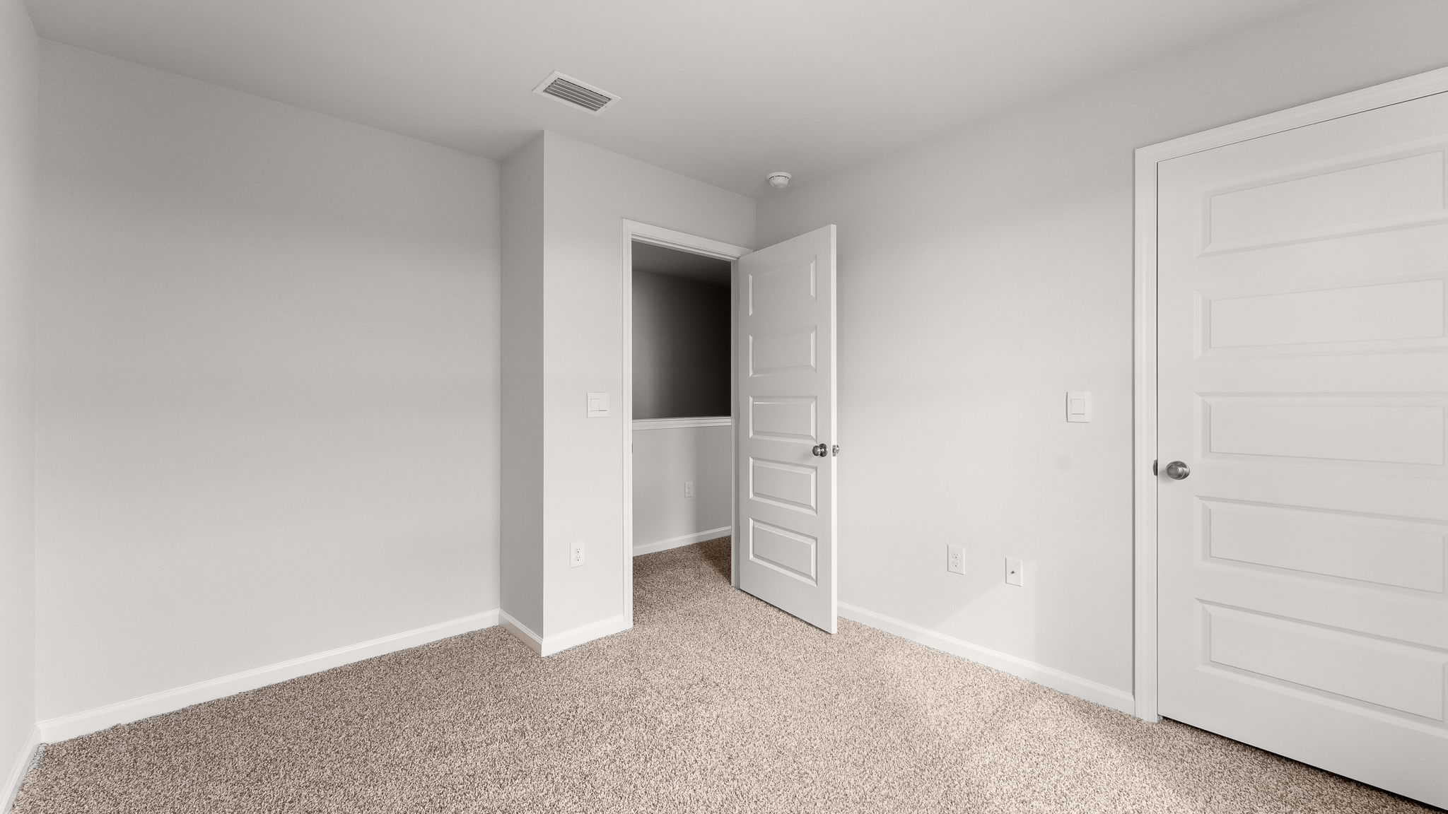Bedroom with carpet floor and closet.