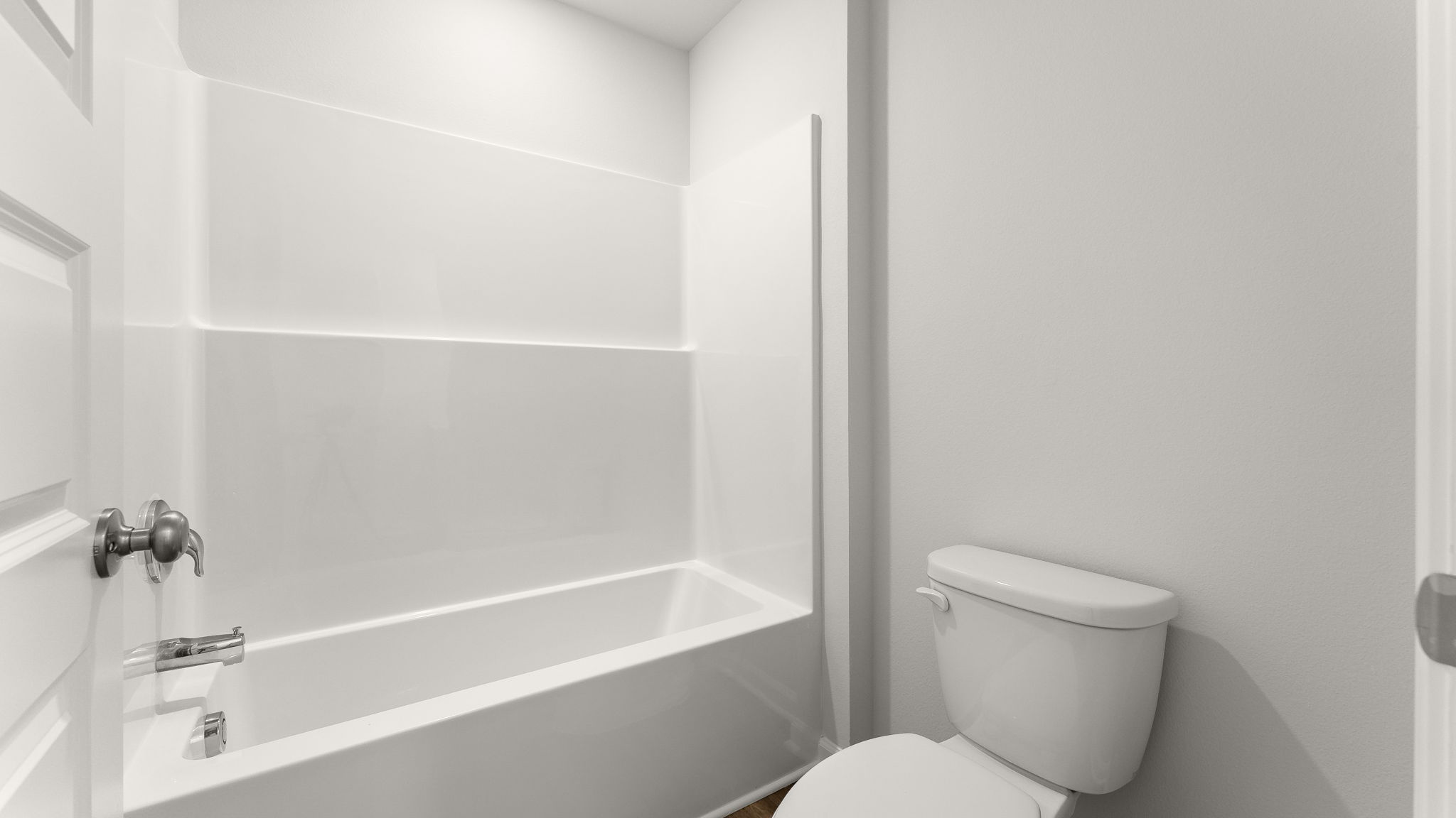 Shower and toilet in guest bathroom.