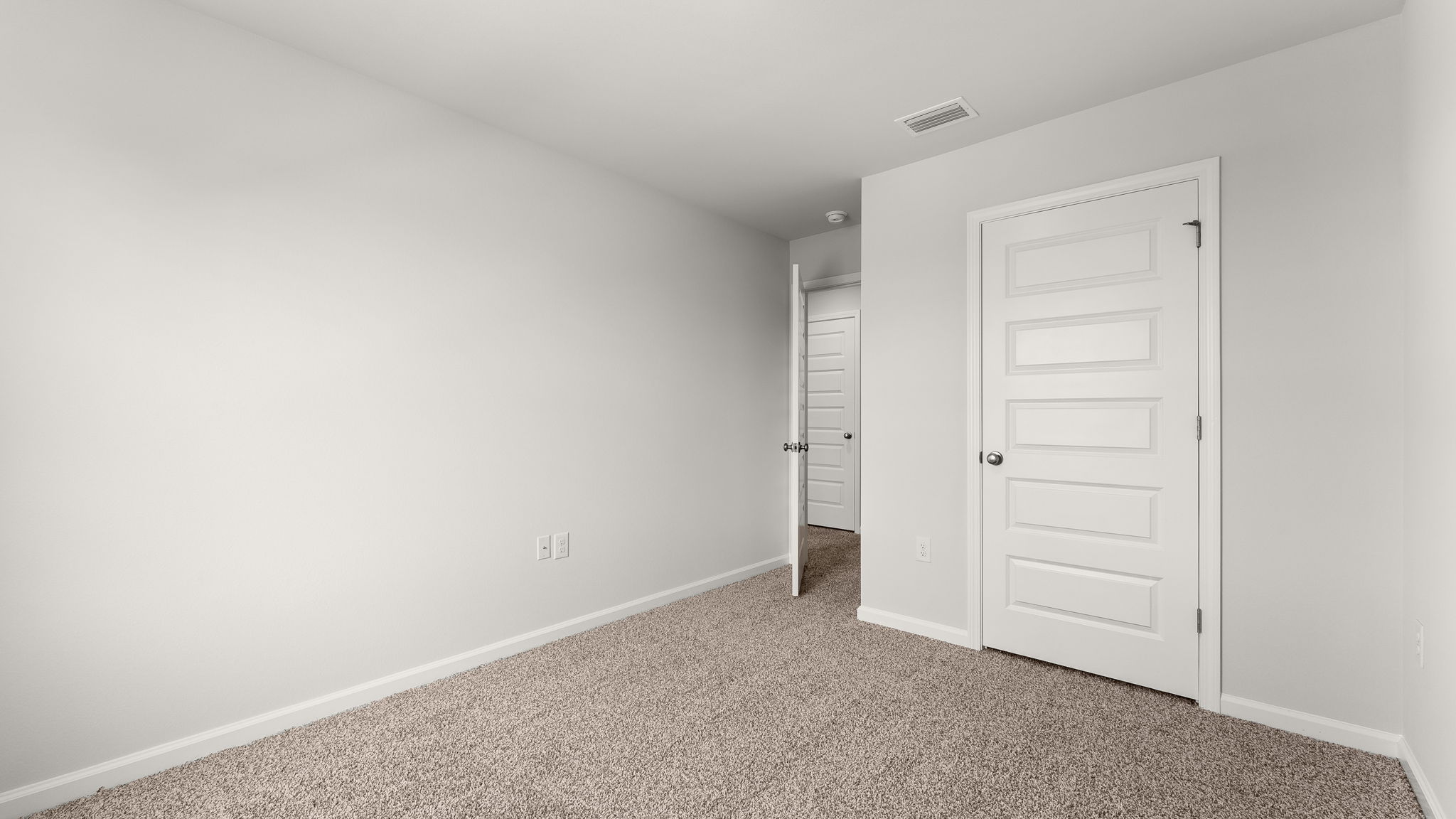 Bedroom with carpet floor and closet.