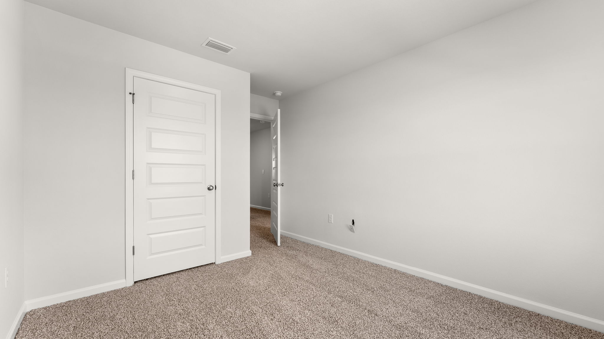 Bedroom with carpet floor and closet.