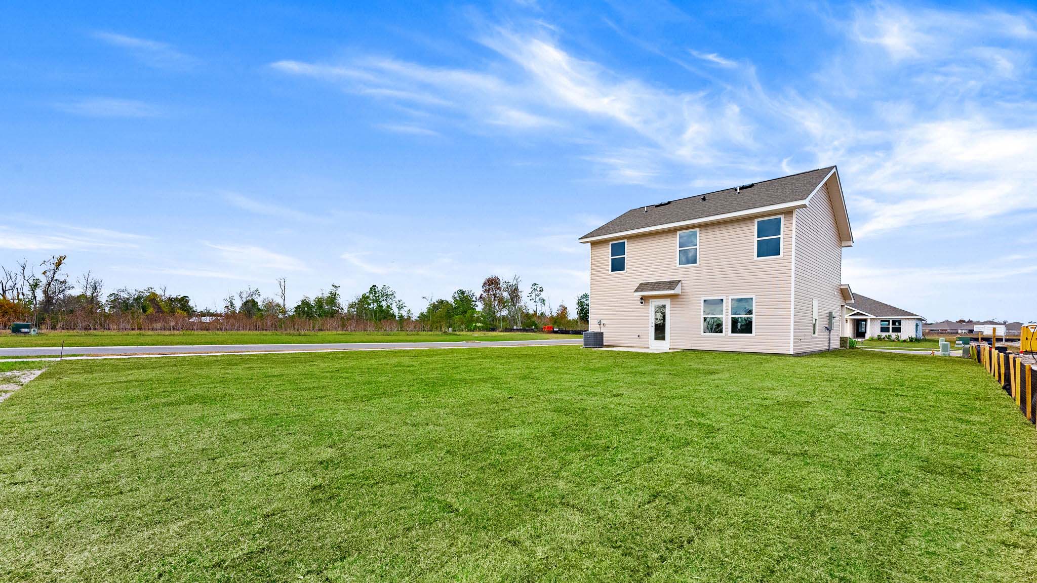 Back yard view of rear of home.