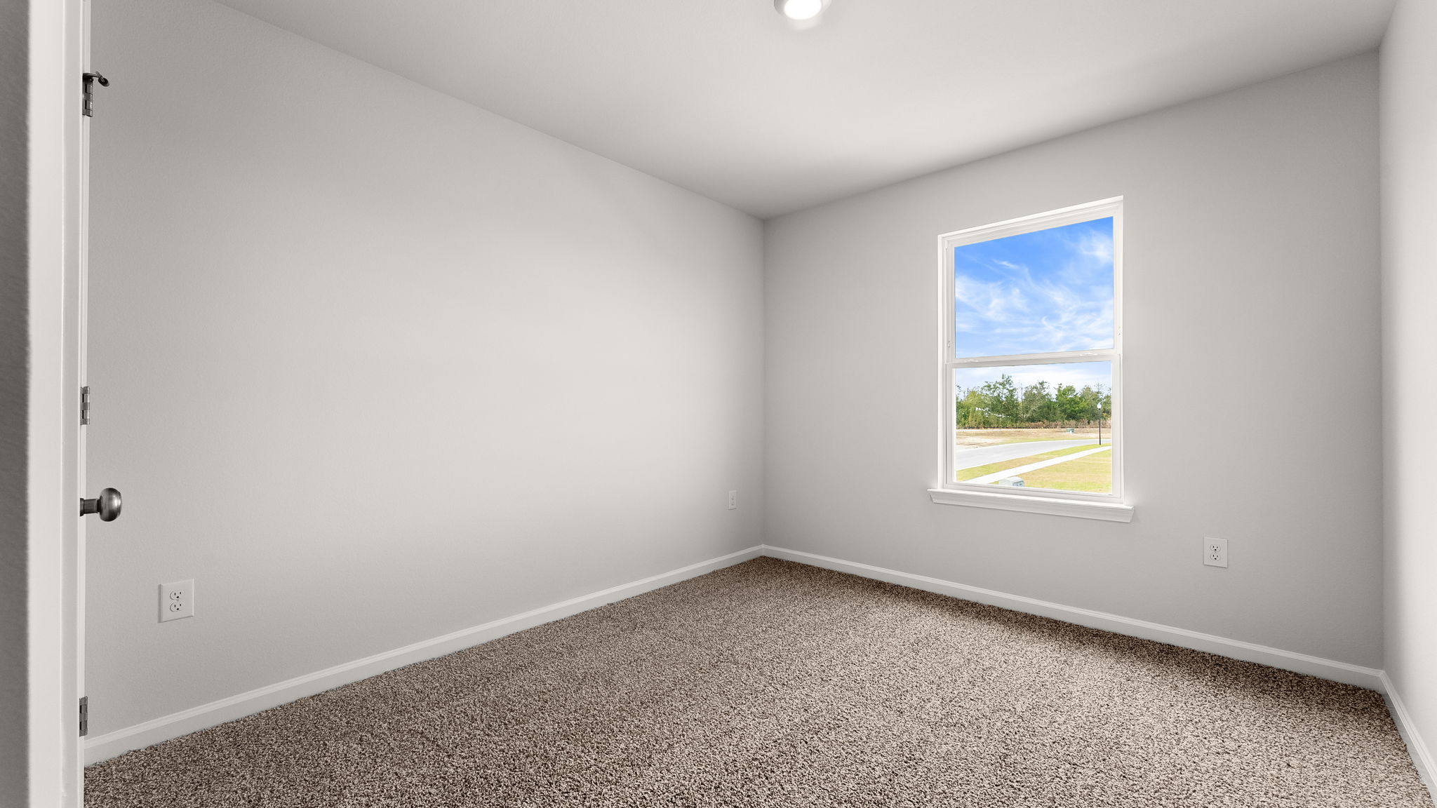 Bedroom with carpet floor and window and closet.