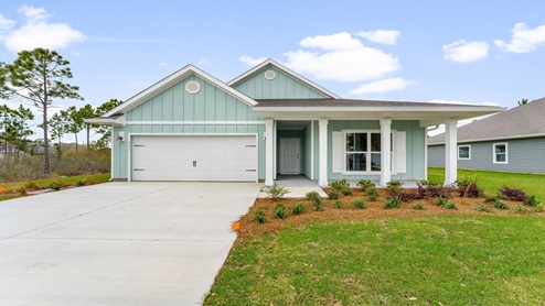 Delray floor plan at Heron Walk with covered front porch and two car garage and Hardie board siding.