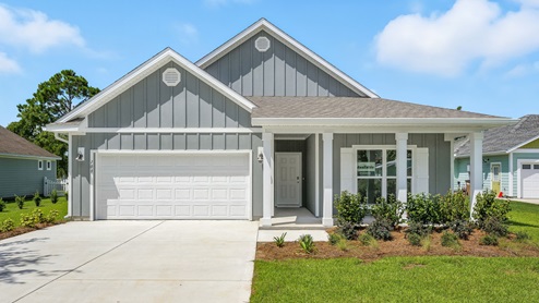 Delray floor plan at Heron Walk with covered front porch and two car garage and Hardie board siding.