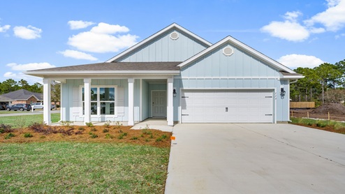 Delray floor plan at Heron Walk with covered front porch and two car garage and Hardie board siding.