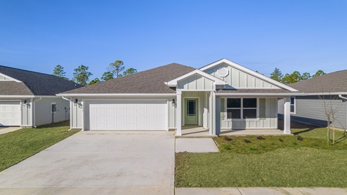 Cali floor plan at Palmetto Bluff front of home with 2 car garage and covered front porch.