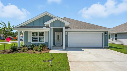 Cali floor plan at Palmetto Bluff with Hardie Board siding and 2 car garage and covered front porch.
