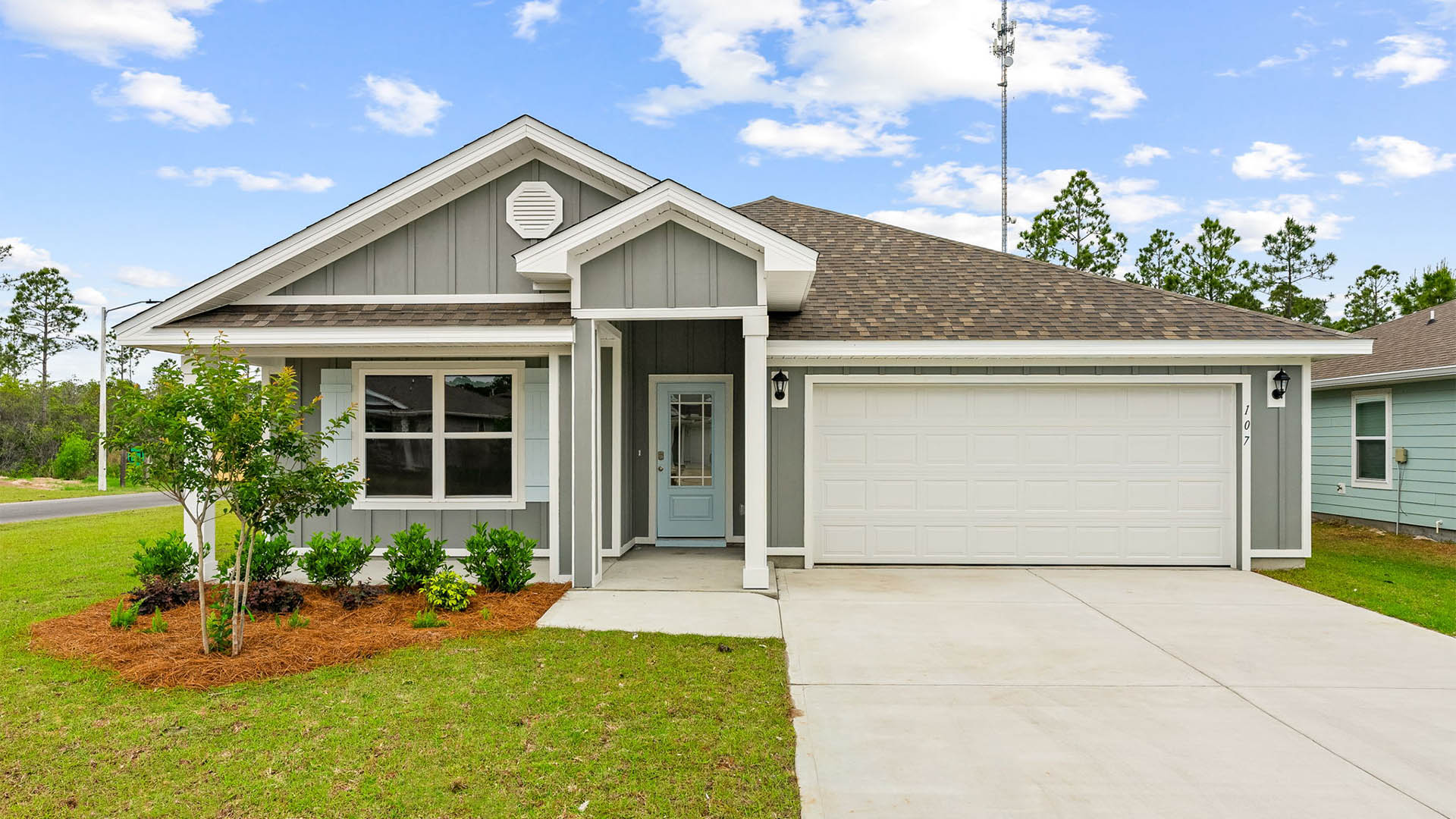 Cali floor plan at Palmetto Bluff with Hardie Board siding and 2 car garage and covered front porch.