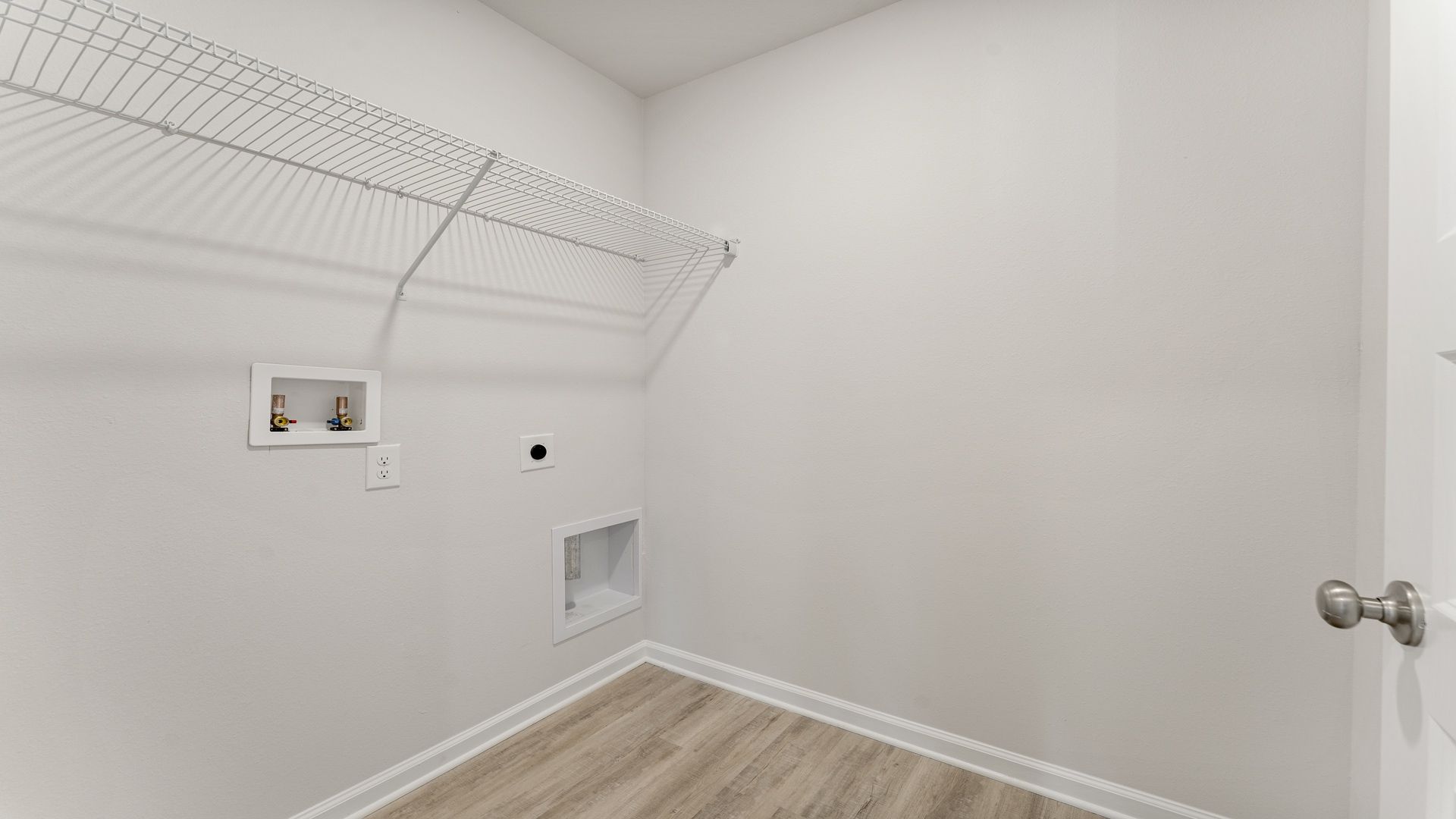 Laundry room with ventilated shelving.