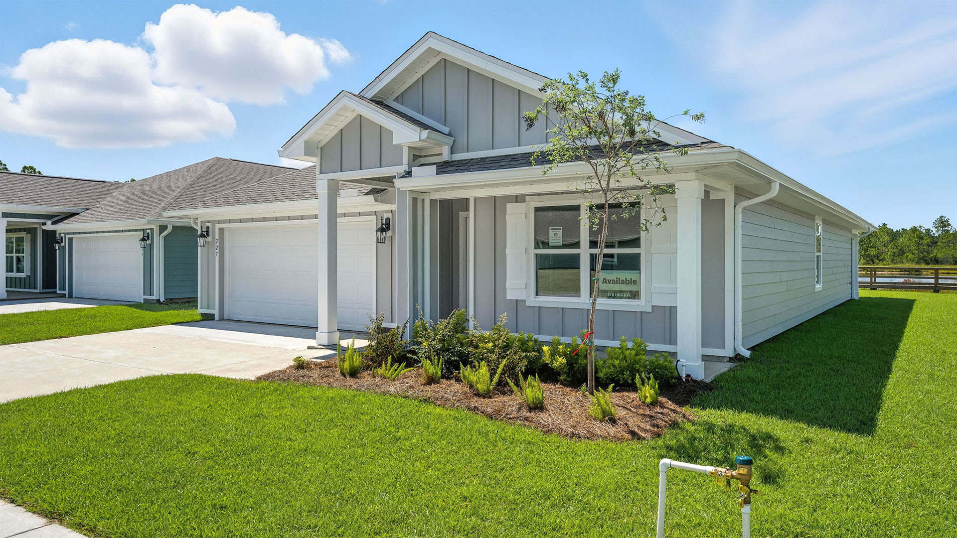 Cali floor plan at Palmetto Bluff with Hardie Board siding and 2 car garage and covered front porch.