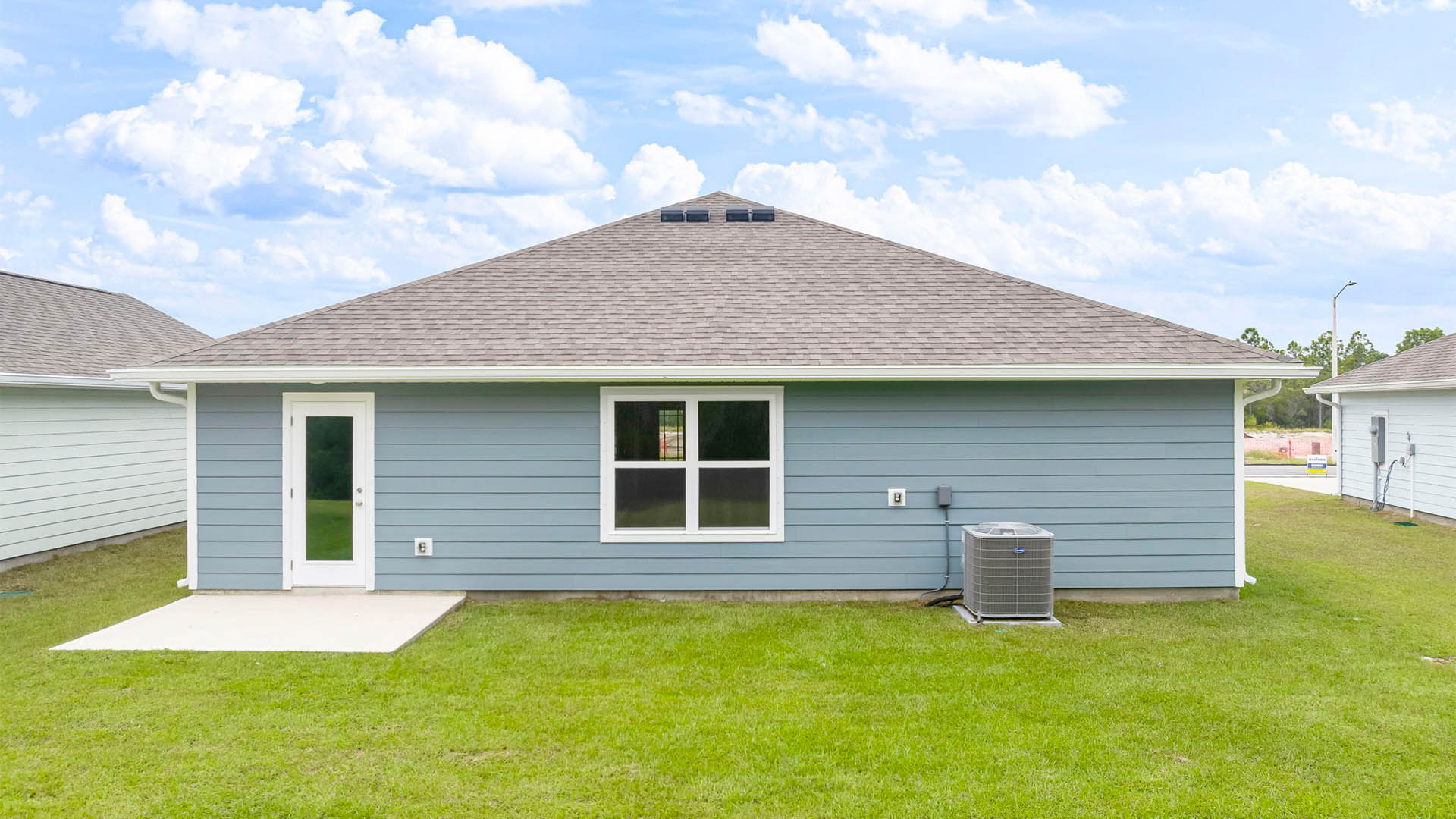 Aldridge floor plan at Palmetto Bluff rear of home with patio and back yard.