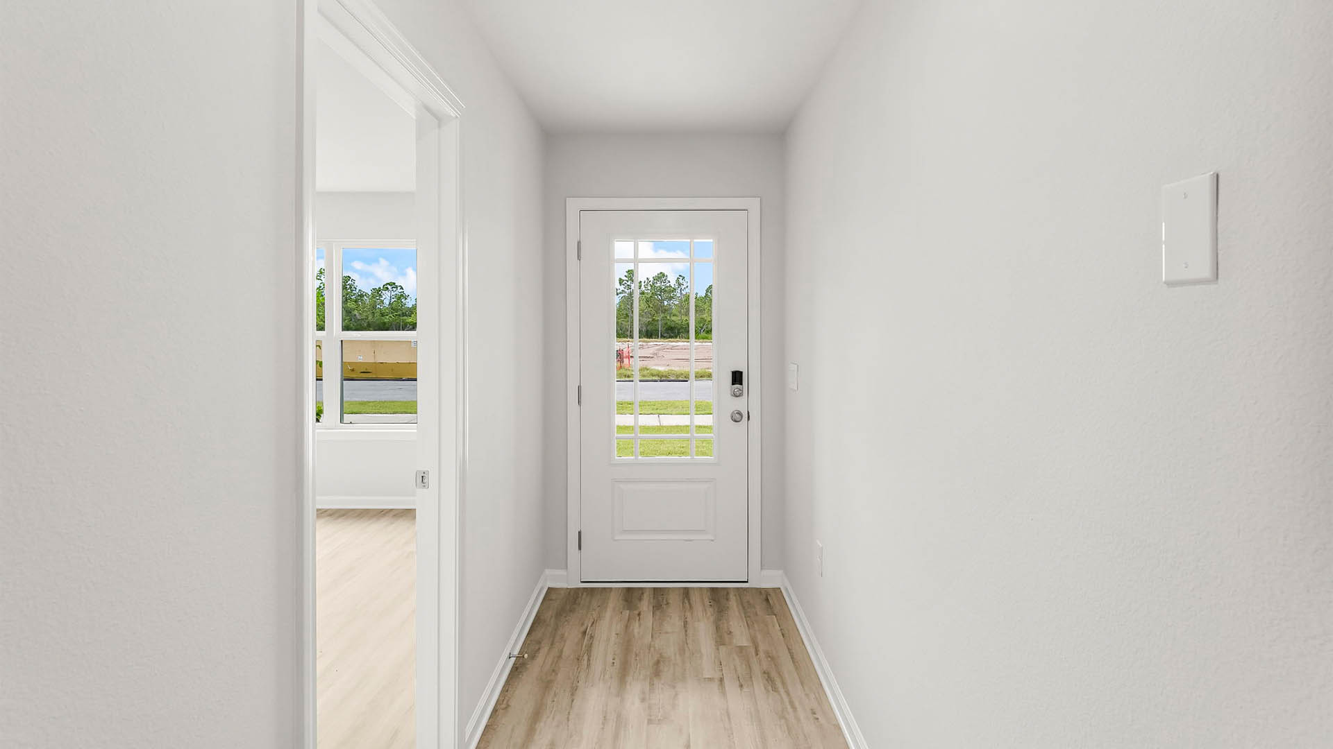 Front door next to primary bedroom.