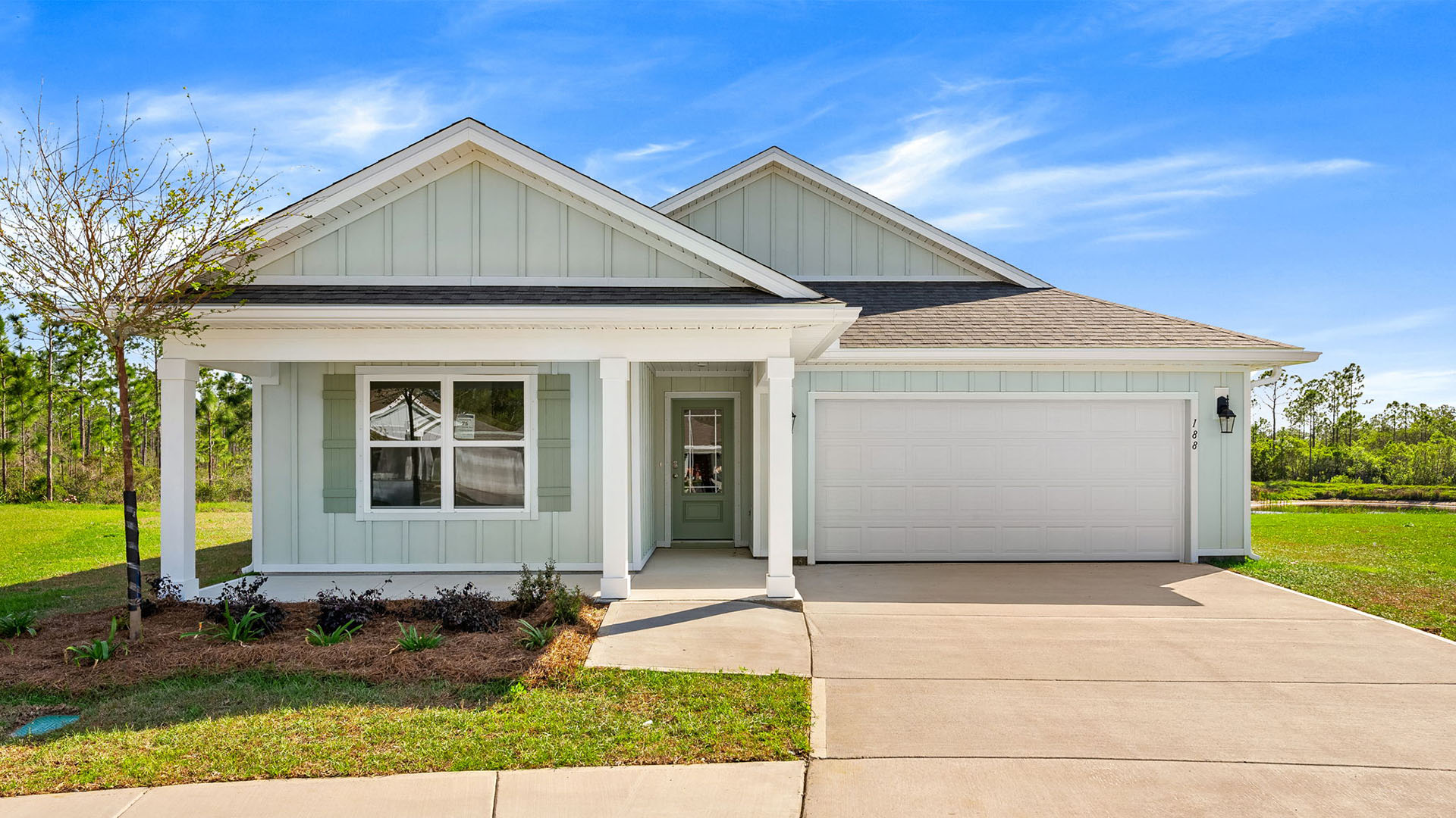 Lakeside Floor plan at Palmetto Bluff with Hardie Board Siding covered front porch and 2 car garage.