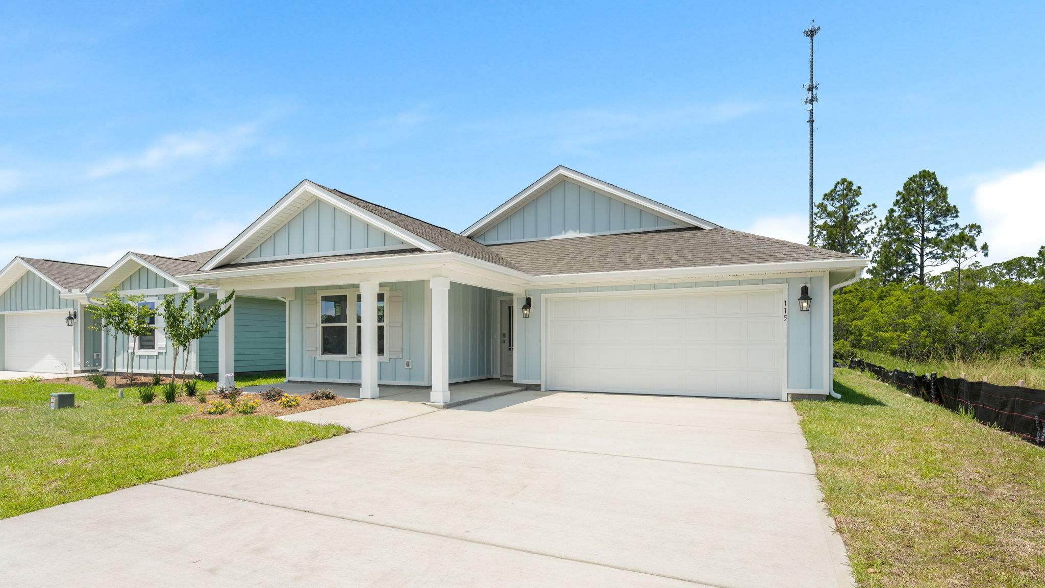 Lakeside Floor plan at Palmetto Bluff with Hardie Board Siding covered front porch and 2 car garage.