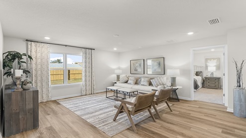 Open living room and kitchen with EVP flooring.