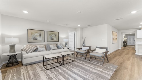 Open living room and kitchen with EVP flooring.
