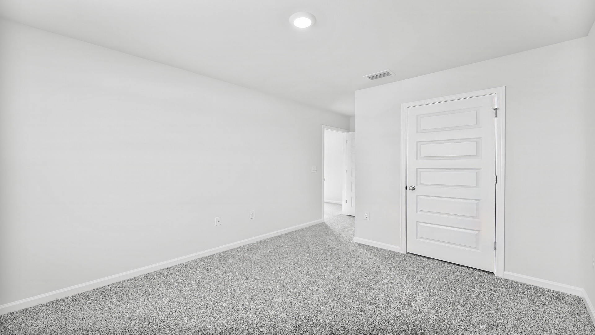 Bedroom with carpet floor and closet.