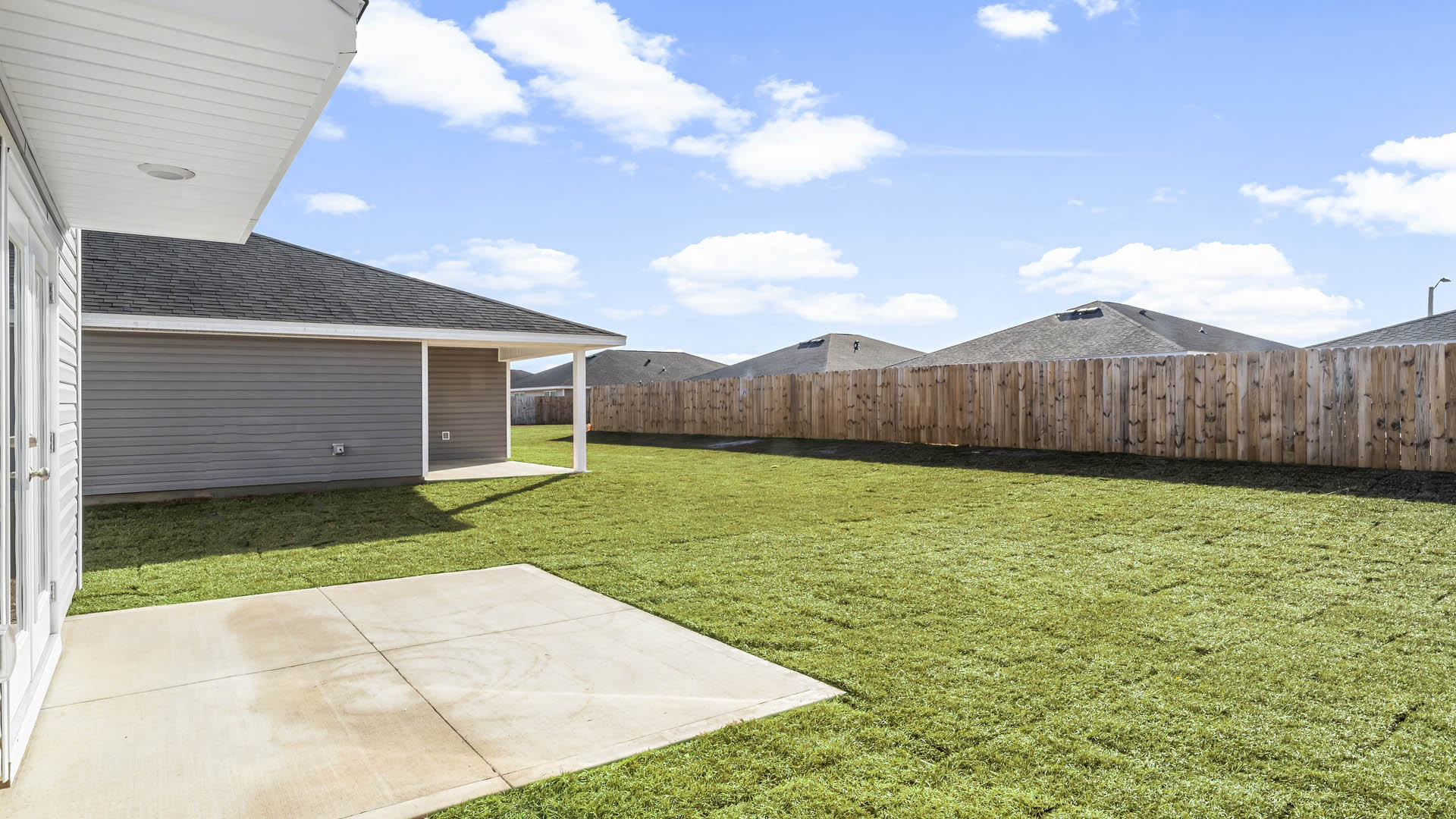 Aisle model at Park Place rear of home and yard.