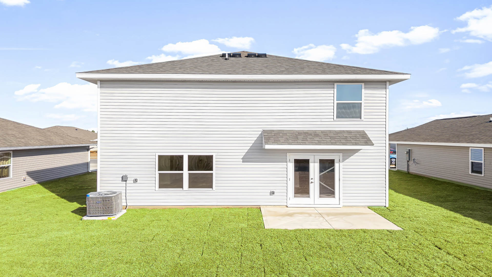 Aisle model at Park Place rear of home and yard.