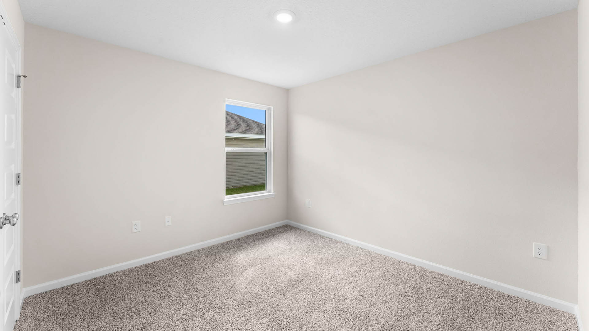 Bedroom with closet and carpet floor and window.