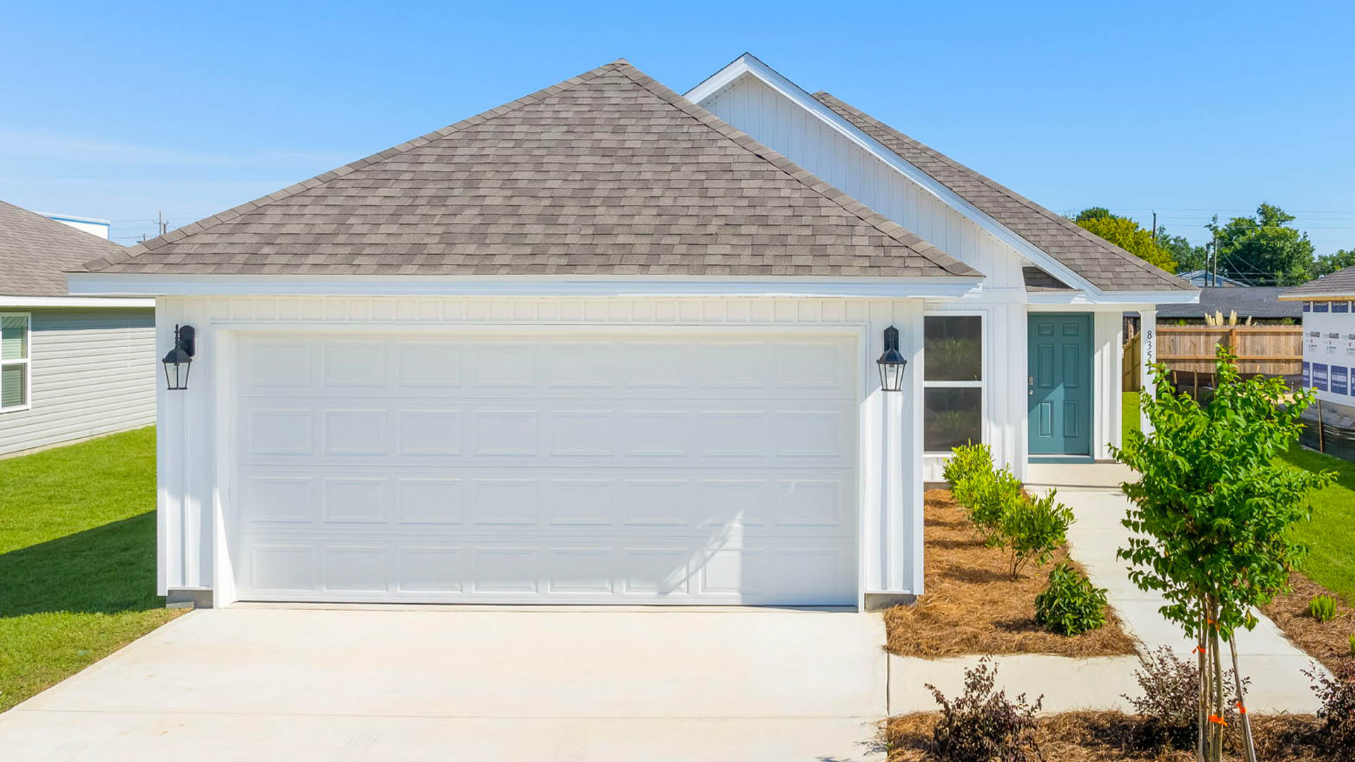 Celeste floor plan at Park Place front of home with vinyl siding and two car garage.