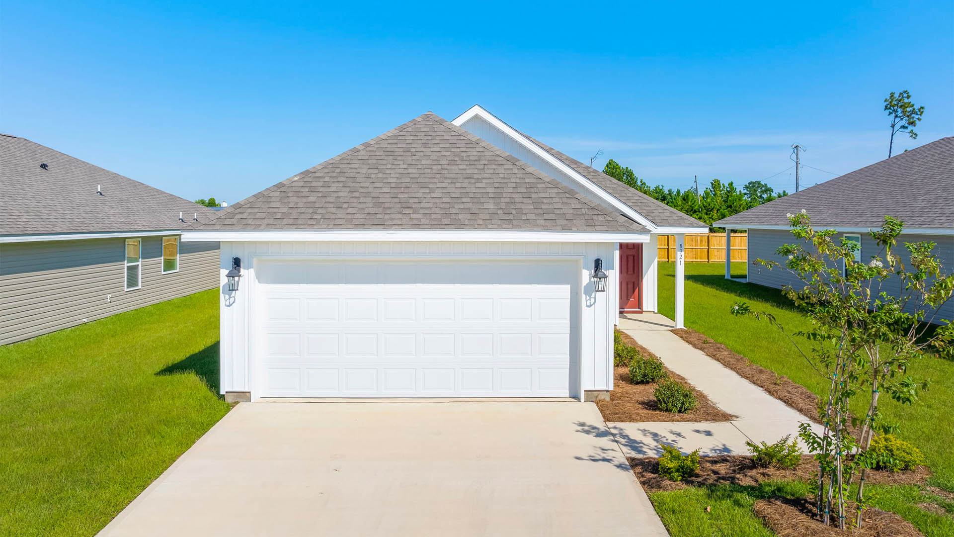Celeste floor plan at Park Place front of home with vinyl siding and two car garage.