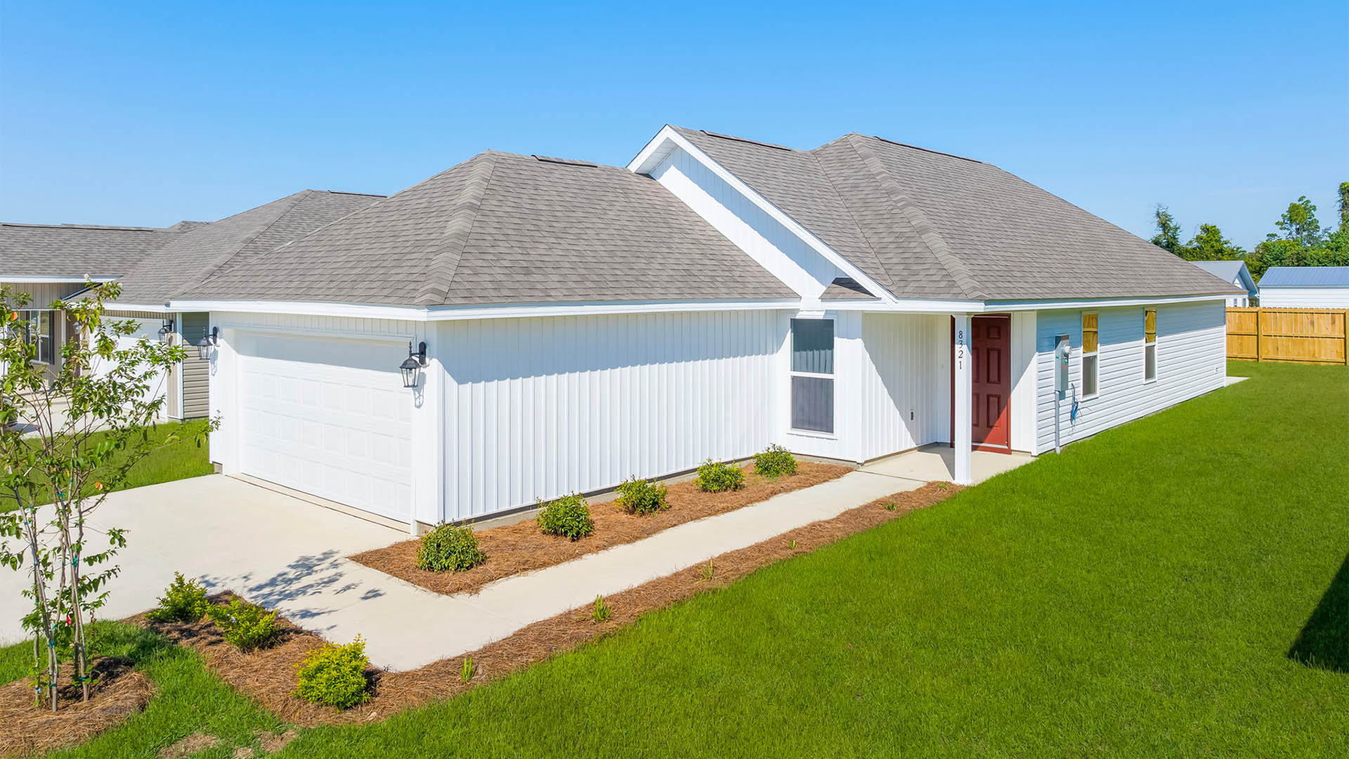 Celeste floor plan at Park Place front of home with vinyl siding and two car garage.