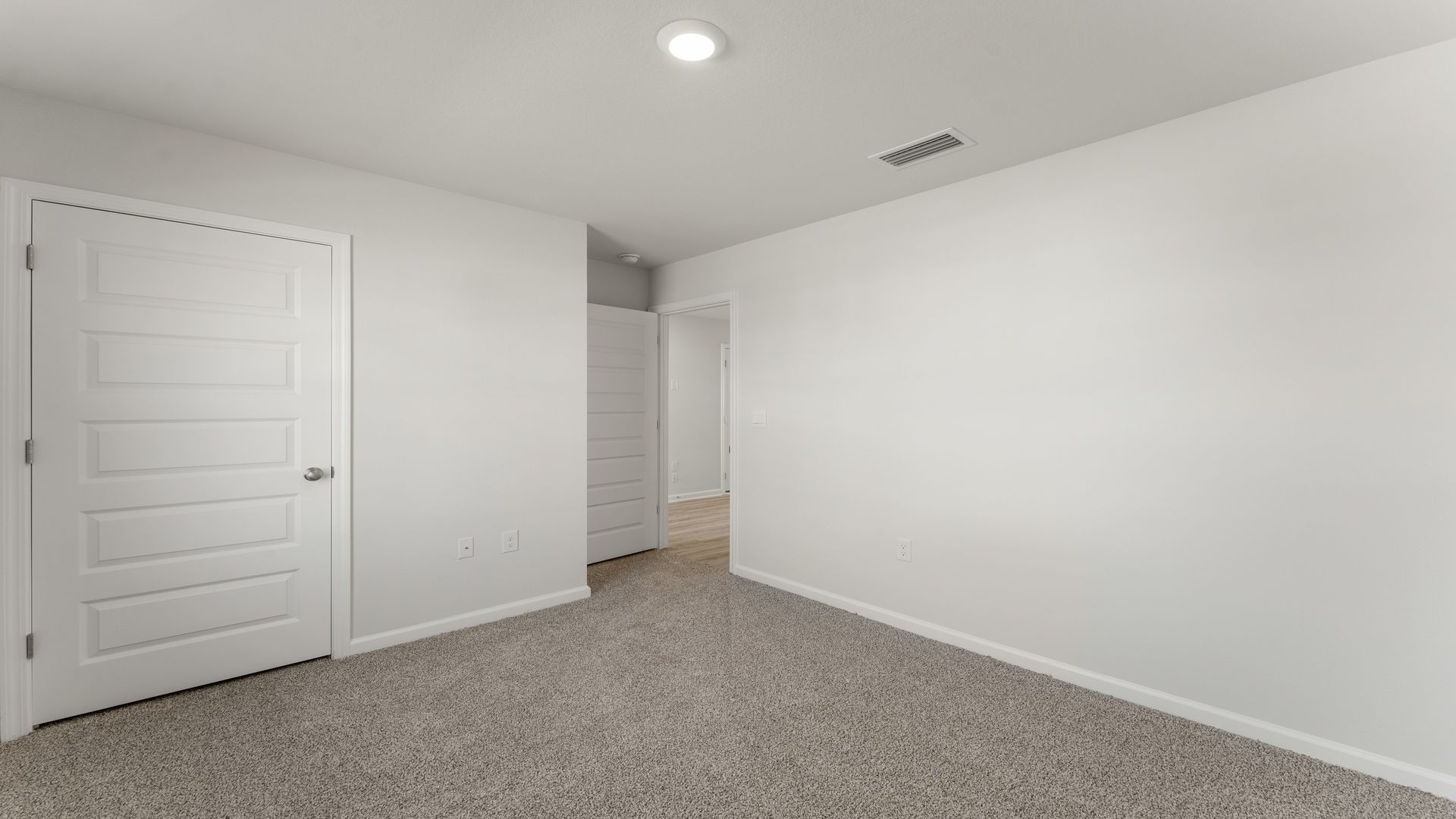 Bedroom with carpet floor and closet.