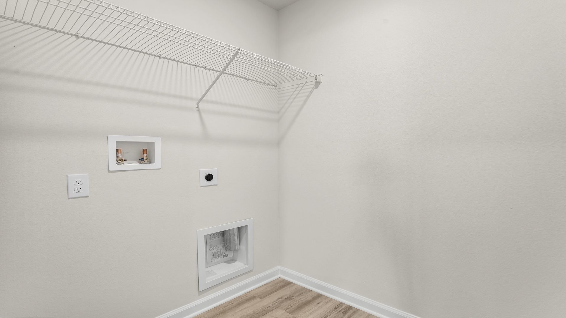 Laundry room with ventilated shelving.