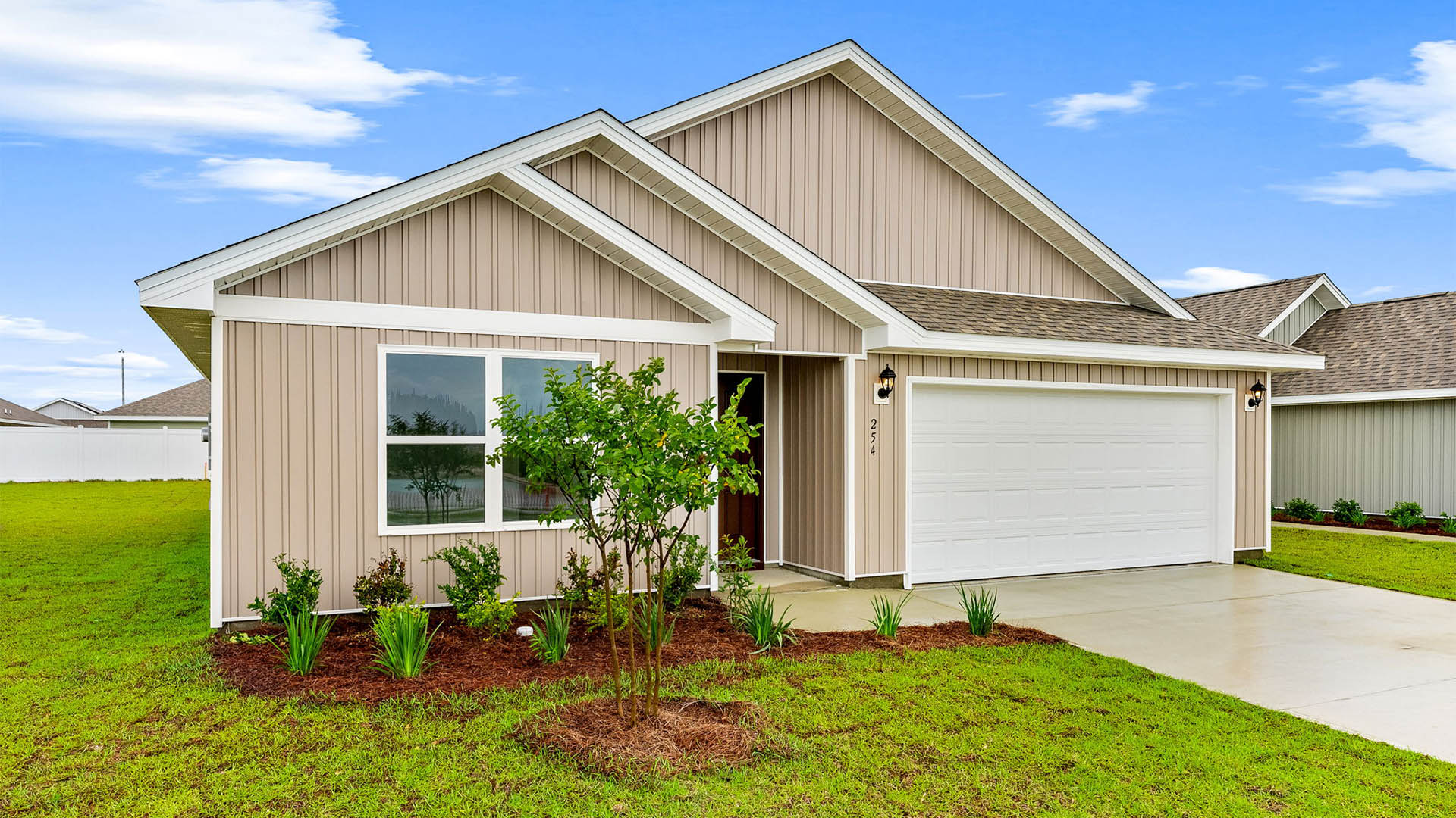 Cali floor plan at Park Place with two-car garage and vinyl siding.