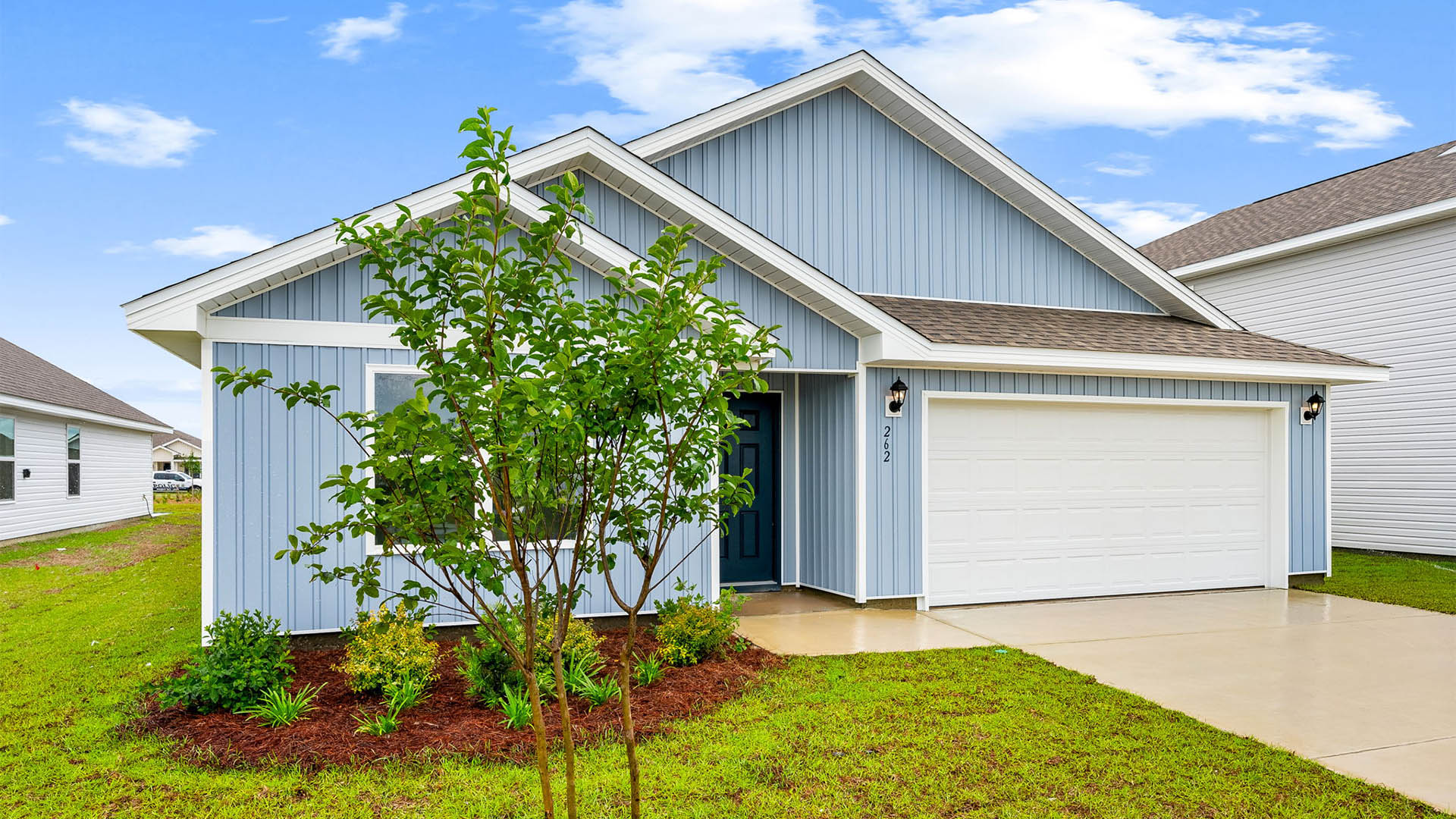 Cali floor plan at Park Place with two-car garage and vinyl siding.